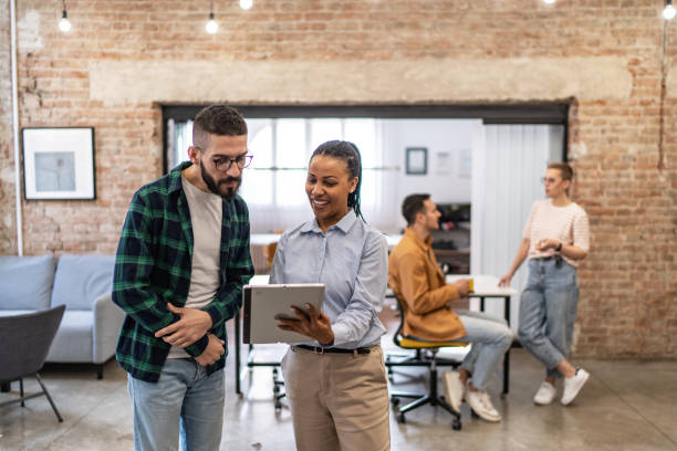 istock Young diverse colleagues having a casual business discussion 2167407565