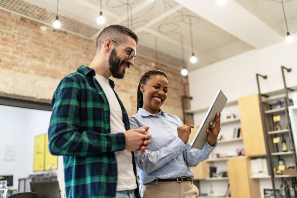 istock Young diverse colleagues having a casual business discussion 2167407631