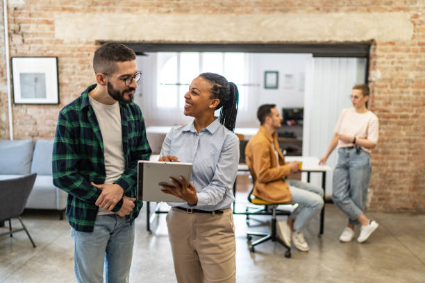 istock Young diverse colleagues having a casual business discussion 2167407755