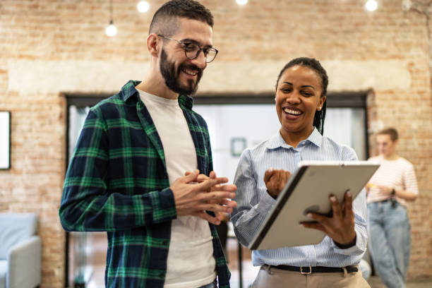 istock Young diverse colleagues having a casual business discussion 2167407914