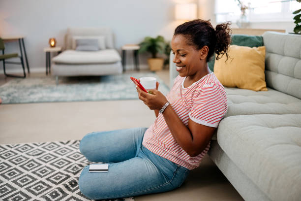 istock Woman uses her phone to pay online 2167410528