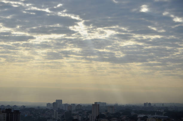 Sunlight passing through the clouds in the sky of the city of São José dos Campos, in the interior of São Paulo