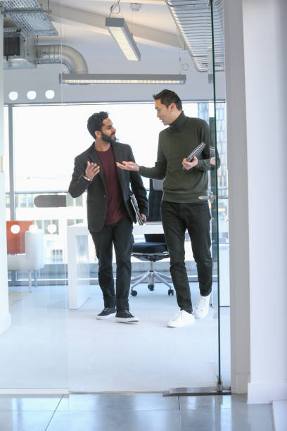 istock Businessmen talking in office 2167411714