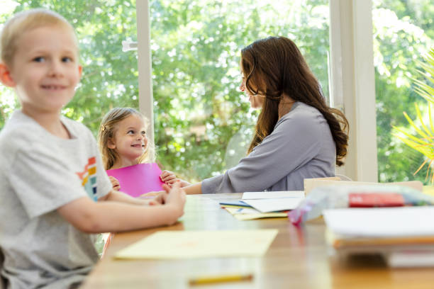istock Single mother enjoys spending time with her kids at the dining room table 2167412234