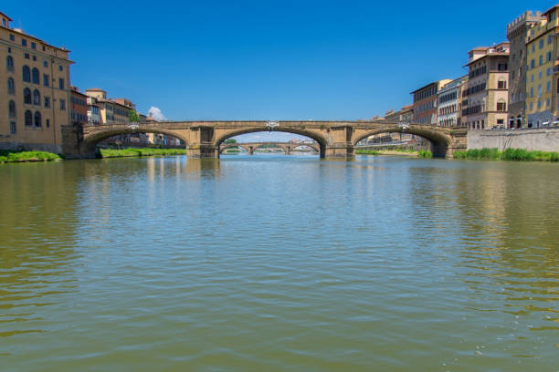 Florence, Tuscany, Italy - July 28, 2020: Sunrise at Ponte Vecchio Florence, Italy with a book