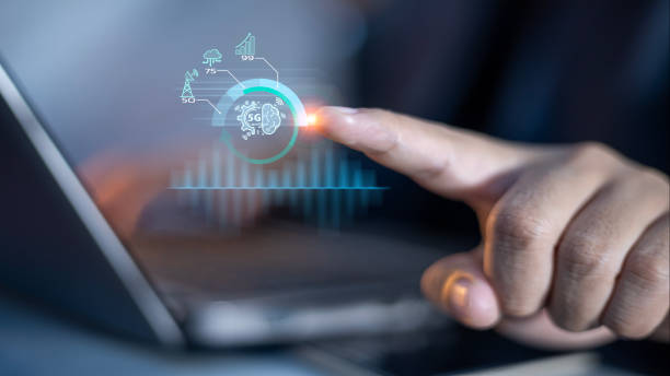 istock A person is pointing at a laptop screen with a green dot on it 2167412999