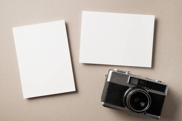 istock White blank greeting or invitation card on beige background. Mockup presentation. Flat lay. 2167413122
