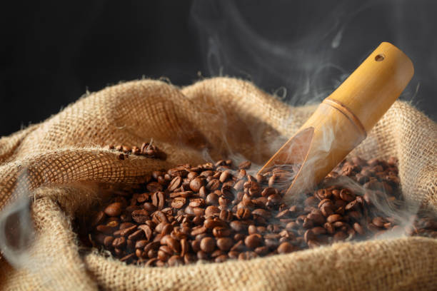 istock Fresh roasted coffee beans in burlap bag. 2167415726
