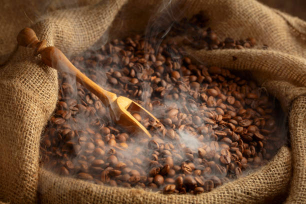 istock Fresh roasted coffee beans in burlap bag. 2167415728