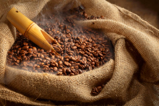 istock Fresh roasted coffee beans in burlap bag. 2167415735