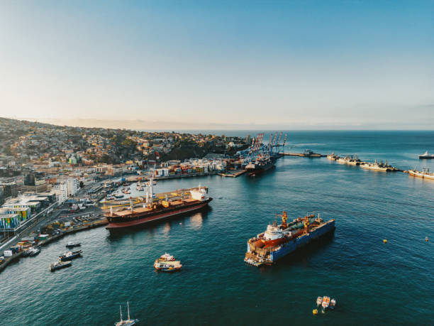 drone view on Harbor and Cityscape of Valparaiso – Chile, Container ships anchoring at the pier