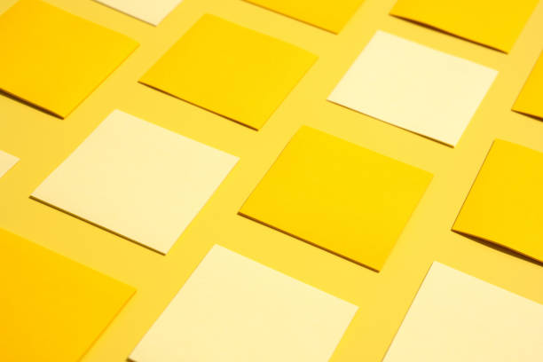 Stylish blank business cards on yellow background, perfect for branding and identity customization. Ideal for marketing and office presentations