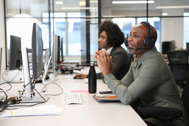 istock Businessman with headset in office 2167421048
