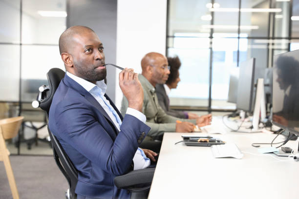 istock Businessman sitting at desk in office 2167421195