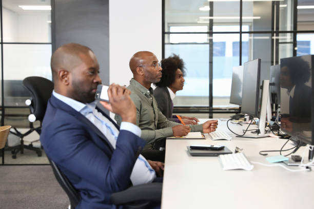 istock Businessman sitting at desk in office 2167421286