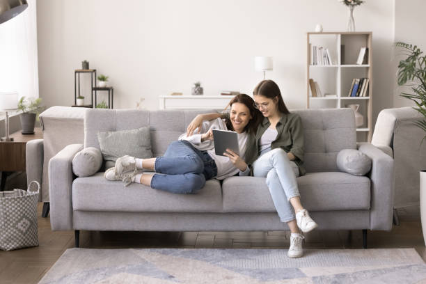 istock Mother and daughter making order, buying on-line using digital tablet 2167422731