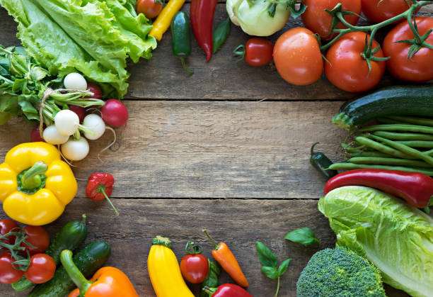 istock image of fresh vegetables on wooden background 2167422895