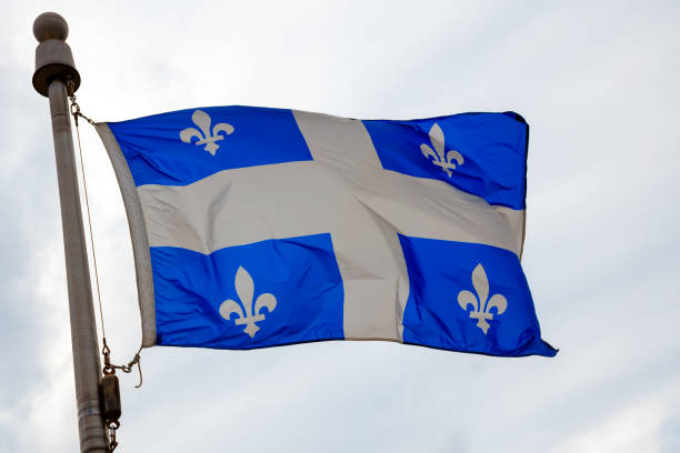istock Quebec Flag Fluttering on Cloudy Day in Canada 2167423868