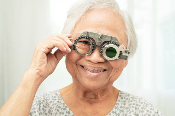 istock Asian senior woman wearing ophthalmic vision eye test and using optical trial frame. 2167424046