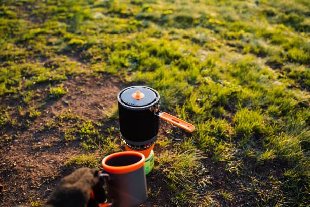 istock Tableware cup and pot resting on grassy groundcover 2167432461