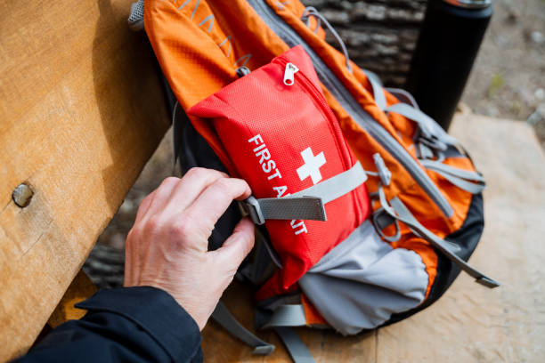 istock A person is stowing a first aid kit in a backpack 2167432489