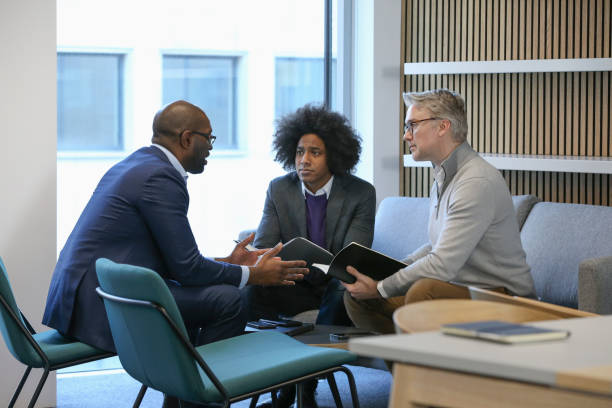 istock Businessmen talking in office 2167433638