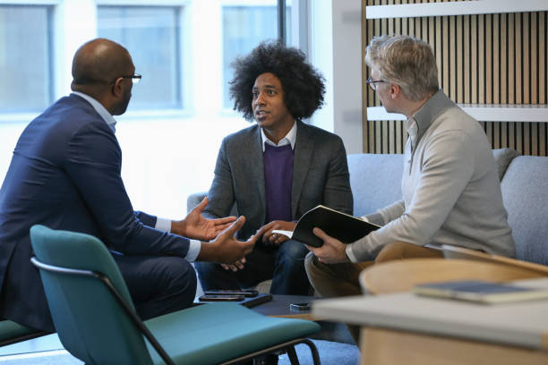 istock Businessmen talking in office 2167433651