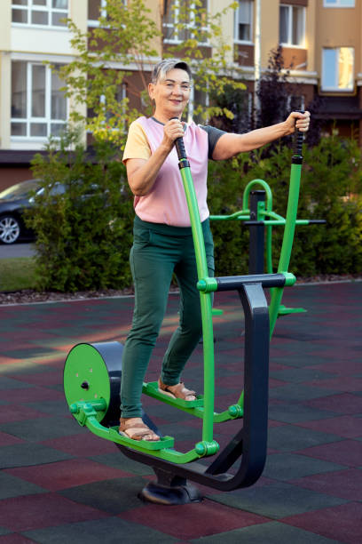 istock Senior woman doing exercises on a street machine. 2167435713