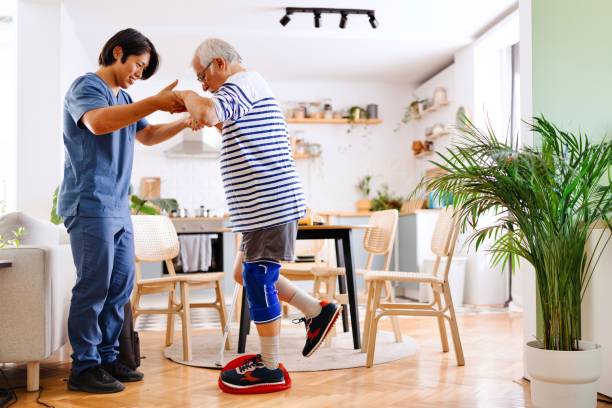 istock Injured senior man doing leg exercises with a physical therapist 2167438381