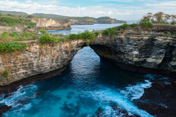istock Blue Waters Beneath Natural Rock Arch 2167438632