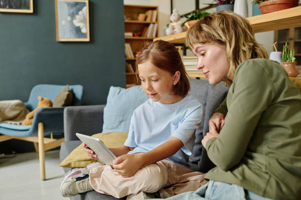 istock Daughter Taking Selfie with Mom 2167443070