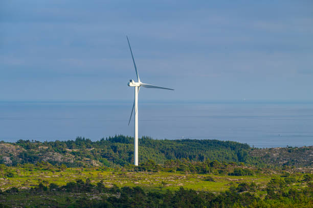 istock Wind power turbine in a hilly landscape.. 2167445306