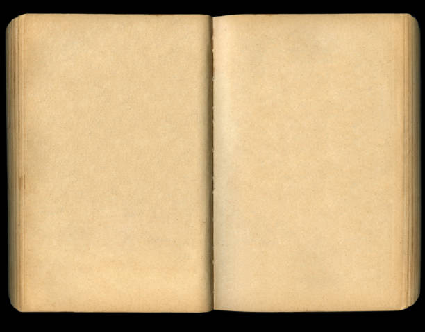 istock Open old book on black background. Top view. 2167446674