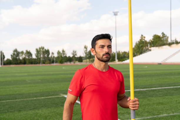 istock An athletic man throws the javelin in the stadium. 2167448188