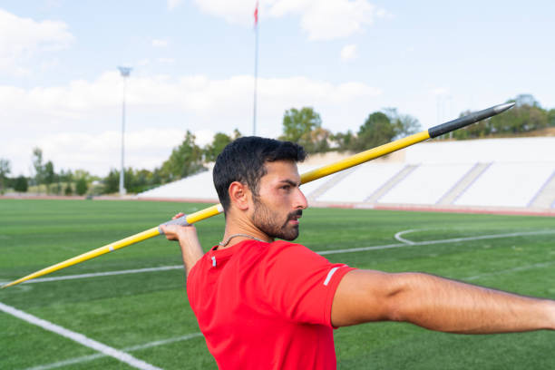 istock An athletic man throws the javelin in the stadium. 2167448221
