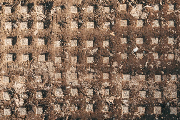 Old worn dirty tactile concrete sidewalk flooring texture, top view