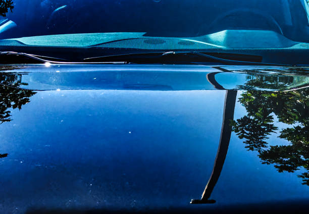 istock The surroundings reflected onto a parked car 2167450160