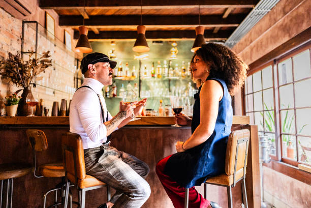 istock Friends talking at a bar 2167451821