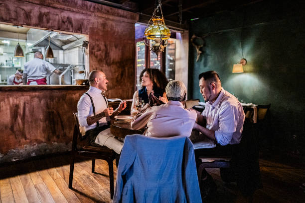 istock Friends talking at a restaurant 2167451854