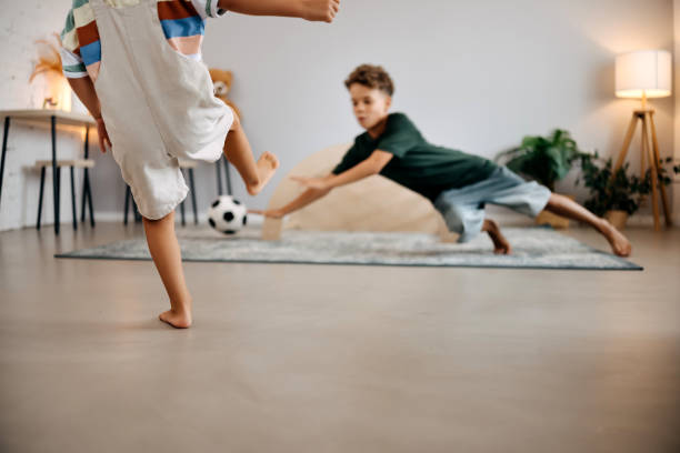 istock Playing football 2167454365