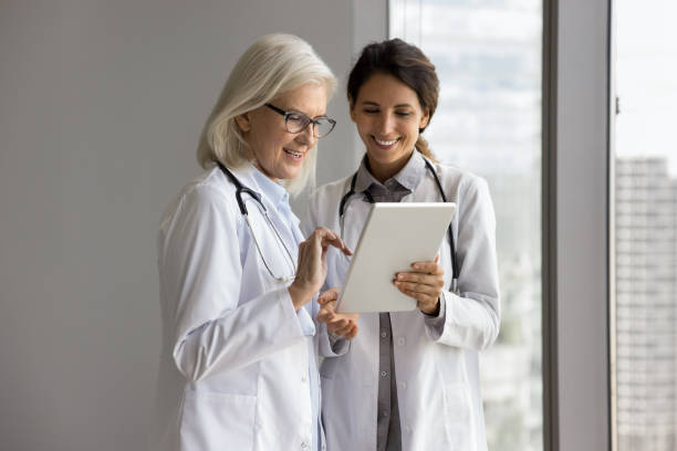istock Doctors using tablet, review e-health application, think on treatment plan 2167455036