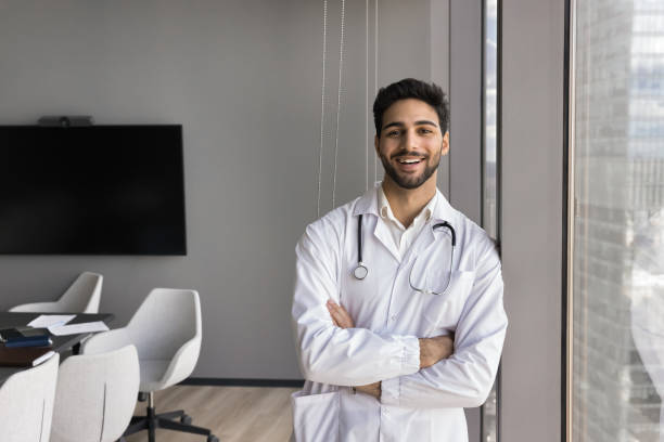 istock Happy millennial Arabic general practitioner posing in conference room 2167455151