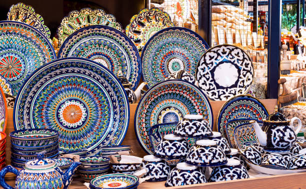 istock Multicolored ceramic tableware with oriental ornaments at the oriental bazaar. Uzbek dishes 2167460811