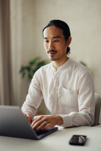 istock Focused Professional Working on Laptop at Modern Office 2167466205