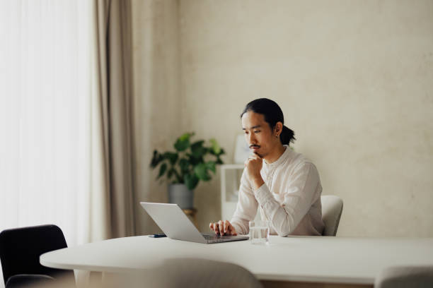 istock Focused Business Professional Working on Laptop in Modern Office 2167466210