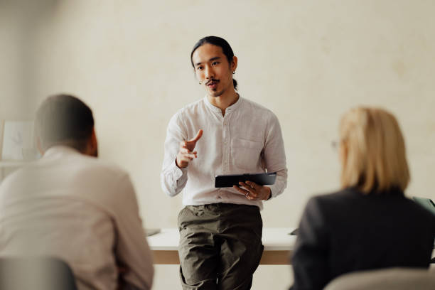 istock Business Team Meeting with Presenter in Office Setting 2167466231