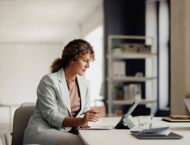 istock Professional Woman Working in Modern Office Setting 2167466274