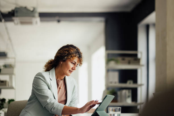 Businesswoman Using Tablet in Modern Office Setting