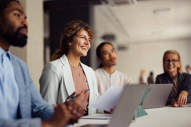 istock Diverse Business Team Collaborating in Modern Office Environment 2167466283
