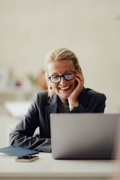 istock Smiling Professional Woman Working on Laptop in Office 2167466307